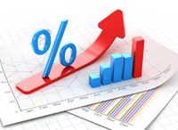 stock-foto-percent-symbol-and-business-chart-on-financial-paper